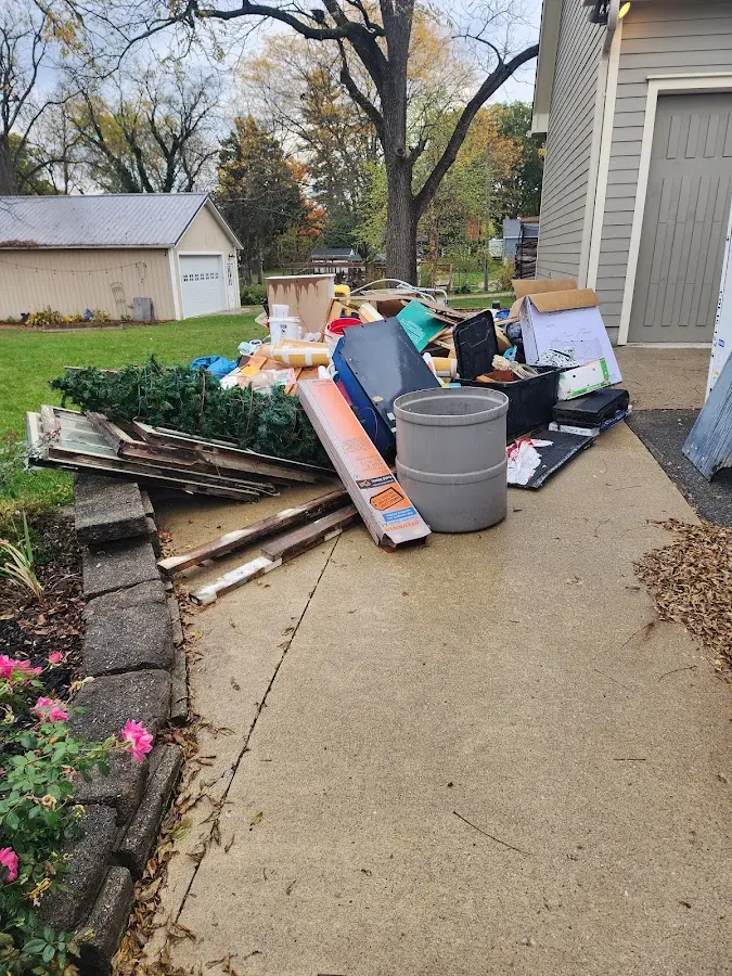 Dumpster being loaded with debris for Residential Dumpster Rental in Charlton